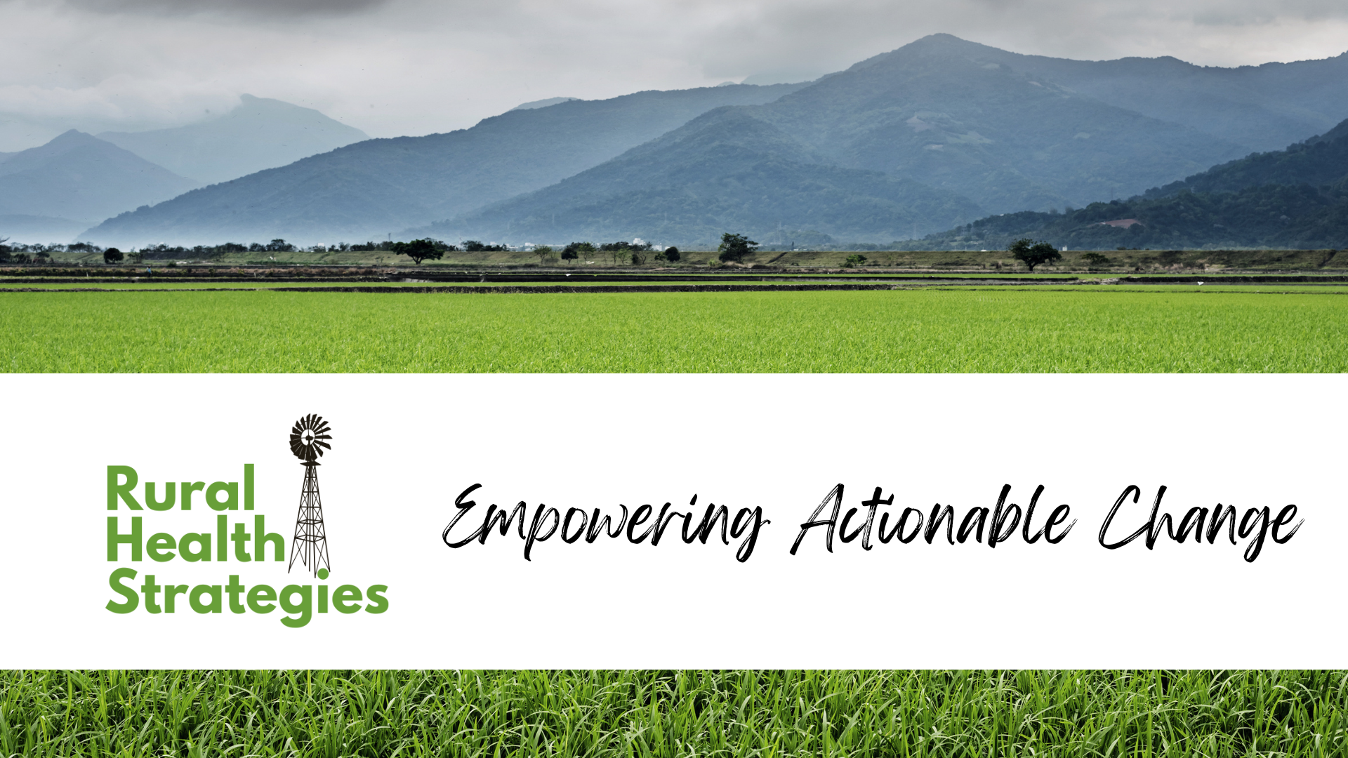 rural scene of green field and distant hills.